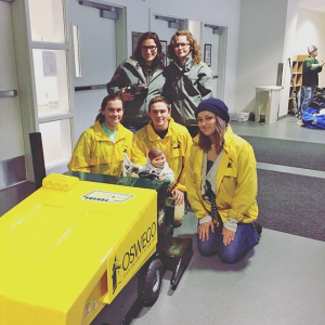 Natalie and Collene (left to right, back row), and Lindsey Kregel, Jacob Alexander and Elizabeth Conrad enjoyed working on Team Mini to promote hockey games. 