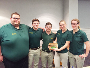 Jacob Alexander, second from left, won third place in the manufacturing competition at TEECA East, along with classmates (left to right) Gerard Lasponara, Devin Murphy, Christine Pyrda, and Amanda Young. The team holds the wooden box dice game they made.