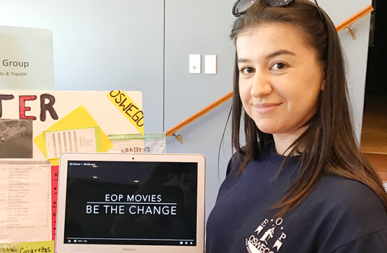 An Educational Opportunity Program student gives a poster and video presentation on pollution along the Lake Ontario shoreline. Photo courtesy of Kristi Eck, SUNY Oswego.
