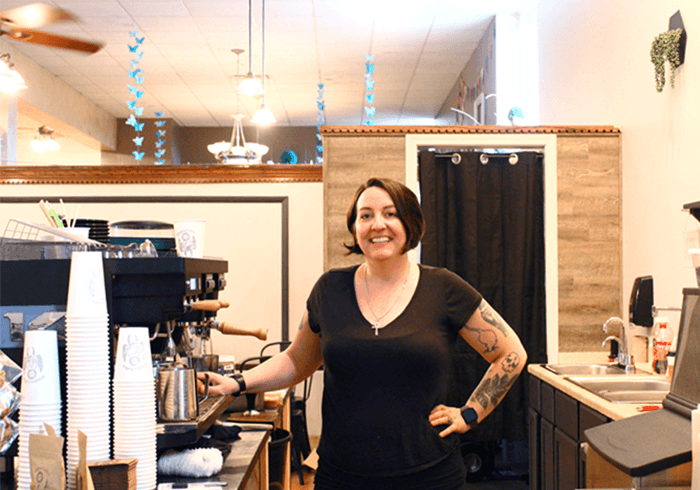 Khepera Coffee in the Canal Commons in Oswego is a very recent addition to the Oswego business community, having opened this past July. Owner Jessica Spano is shown next to the espresso coffee maker.