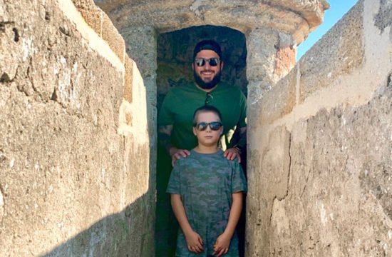 Matt Crary and his son at the Castillo de Son Marco in St. Augustine, Florida, last summer. Crary is heading to graduate school, where he plans to major in history.