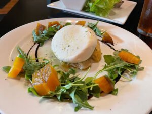 Burrata panzanella appetizer.