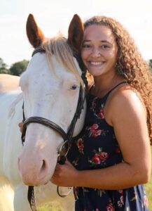 Jess Forza, from Riverhead, Long Island, will graduate with a Bachelor of Fine Arts double majoring in English and creative writing, with a minor in journalism. Forza hopes to blend her writing and journalism skills with her passion for equestrianism by working at a professional horse-riding venue as a sports journalist.